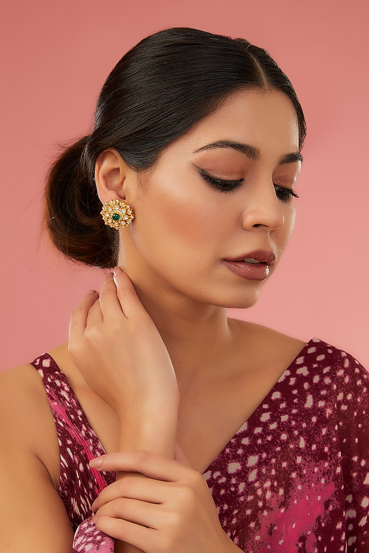 Gold Finish Moissanite Polki & Synthetic Emerald Stud Earrings In Sterling Silver by STELLA CREATIONS at Pernia's Pop Up Shop