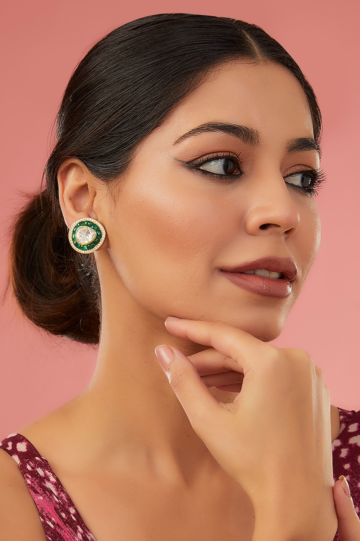 Gold Finish Moissanite Polki & Synthetic Emerald Stud Earrings In Sterling Silver by STELLA CREATIONS at Pernia's Pop Up Shop