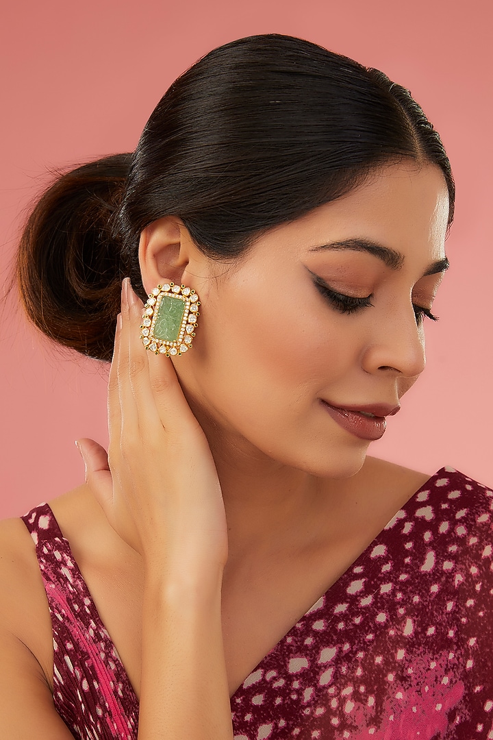 Gold Finish Moissanite Polki & Synthetic Emerald Stud Earrings In Sterling Silver by STELLA CREATIONS at Pernia's Pop Up Shop