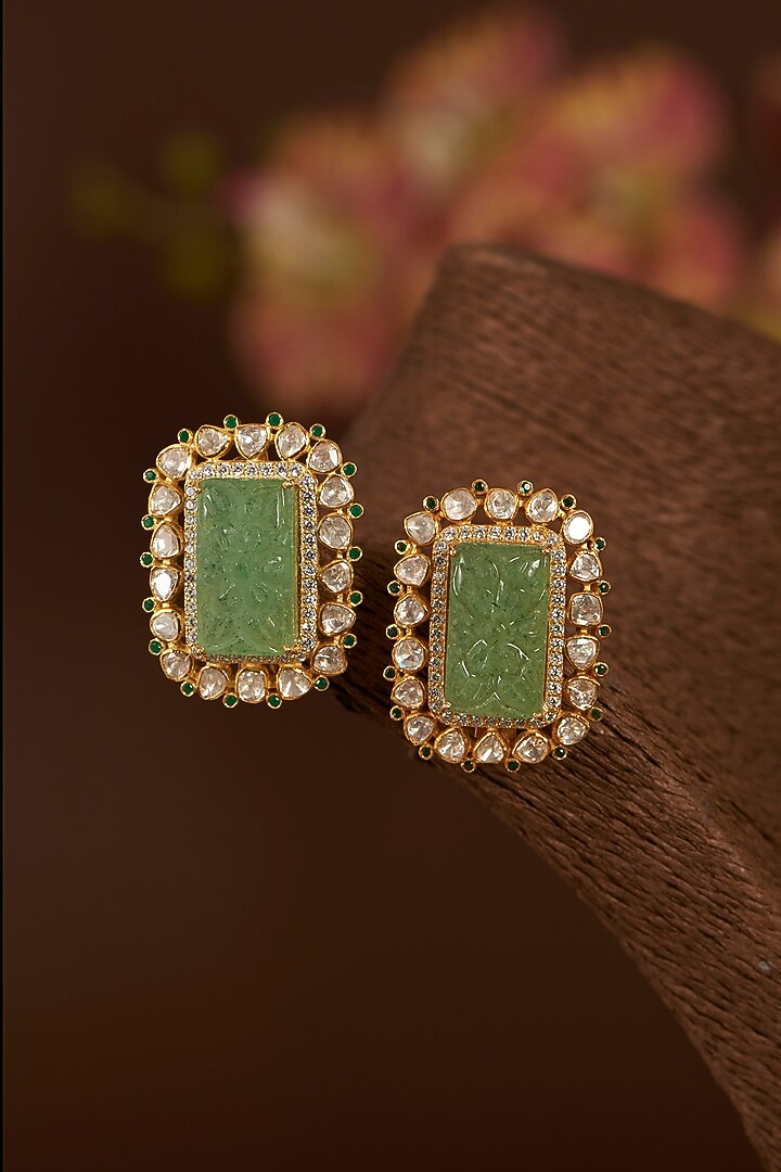 Gold Finish Moissanite Polki & Synthetic Emerald Stud Earrings In Sterling Silver by STELLA CREATIONS at Pernia's Pop Up Shop