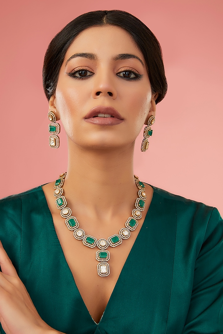 Gold Finish Moissanite Polki & Synthetic Emerald Necklace Set In Sterling Silver by STELLA CREATIONS at Pernia's Pop Up Shop