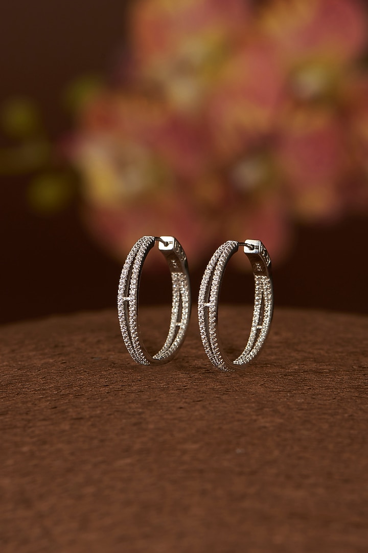 White Finish Eurostar CZ Hoop Earrings In Sterling Silver by STELLA CREATIONS at Pernia's Pop Up Shop