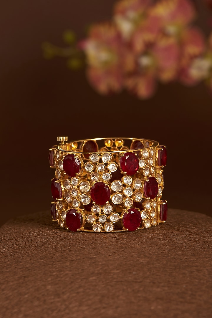 Gold Finish Moissanite Polki & Synthetic Ruby Bangle In Sterling Silver by STELLA CREATIONS at Pernia's Pop Up Shop