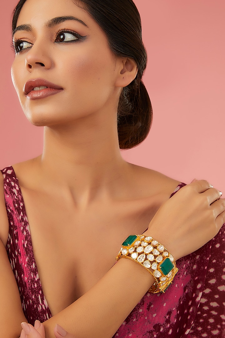 Gold Finish Moissanite Polki & Synthetic Emerald Bangle In Sterling Silver by STELLA CREATIONS at Pernia's Pop Up Shop