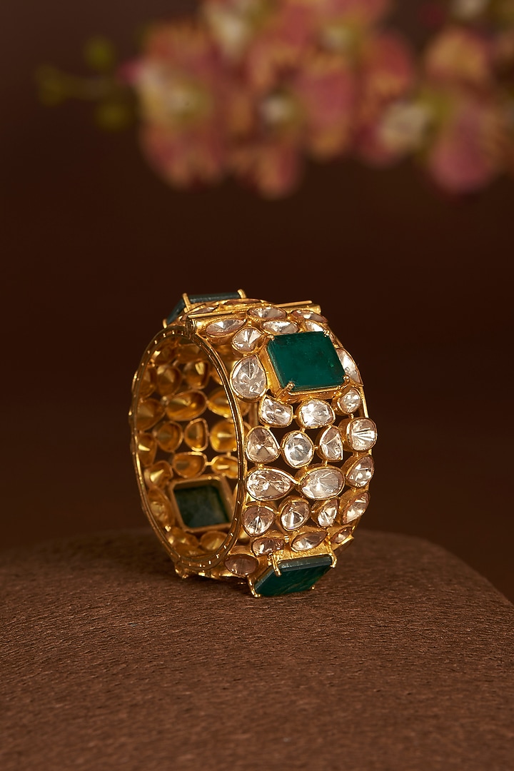 Gold Finish Moissanite Polki & Synthetic Emerald Bangle In Sterling Silver by STELLA CREATIONS at Pernia's Pop Up Shop