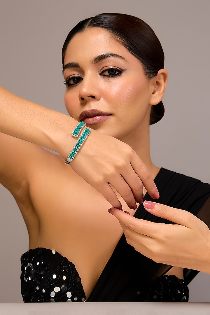 White Finish Zircon & Emerald Stone Bracelet In Sterling Silver by STELLA CREATIONS at Pernia's Pop Up Shop