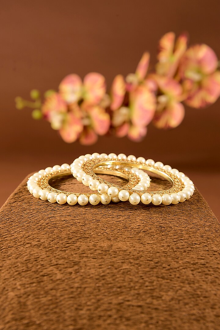 Gold Finish White Pearl Bangles In Sterling Silver (Set Of 2) by STELLA CREATIONS at Pernia's Pop Up Shop