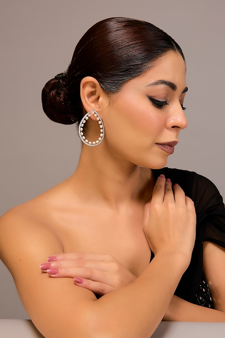 White Finish Pearl Hoop Earrings In Sterling Silver by STELLA CREATIONS at Pernia's Pop Up Shop