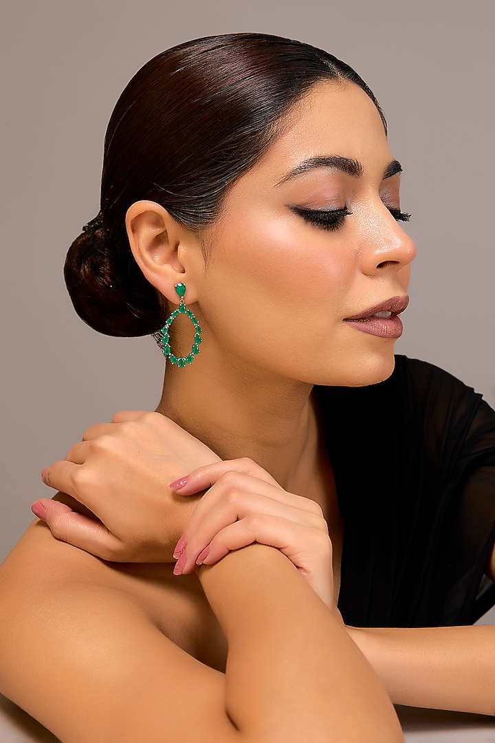 White Finish Zircon & Emerald Stone Dangler Earrings In Sterling Silver by STELLA CREATIONS at Pernia's Pop Up Shop