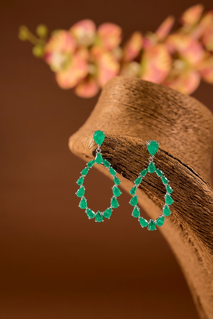 White Finish Zircon & Emerald Stone Dangler Earrings In Sterling Silver by STELLA CREATIONS at Pernia's Pop Up Shop