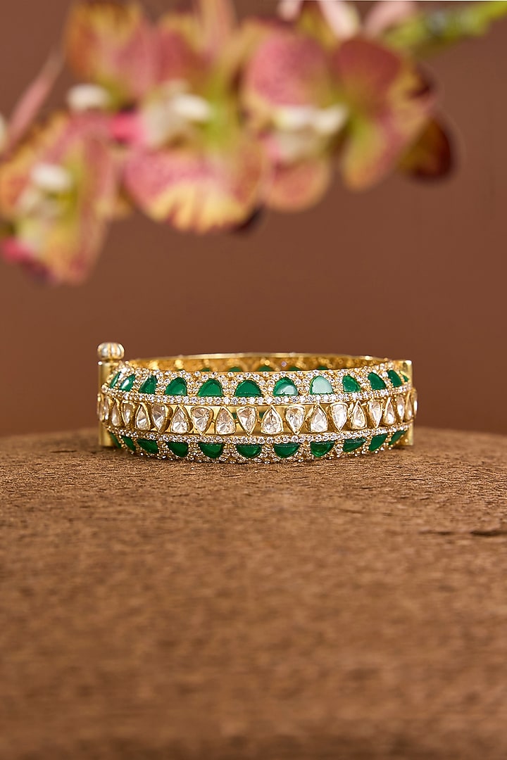 Yellow Gold Finish Moissanite Polki & Emerald Stone Openable Bangle In Sterling Silver by STELLA CREATIONS at Pernia's Pop Up Shop
