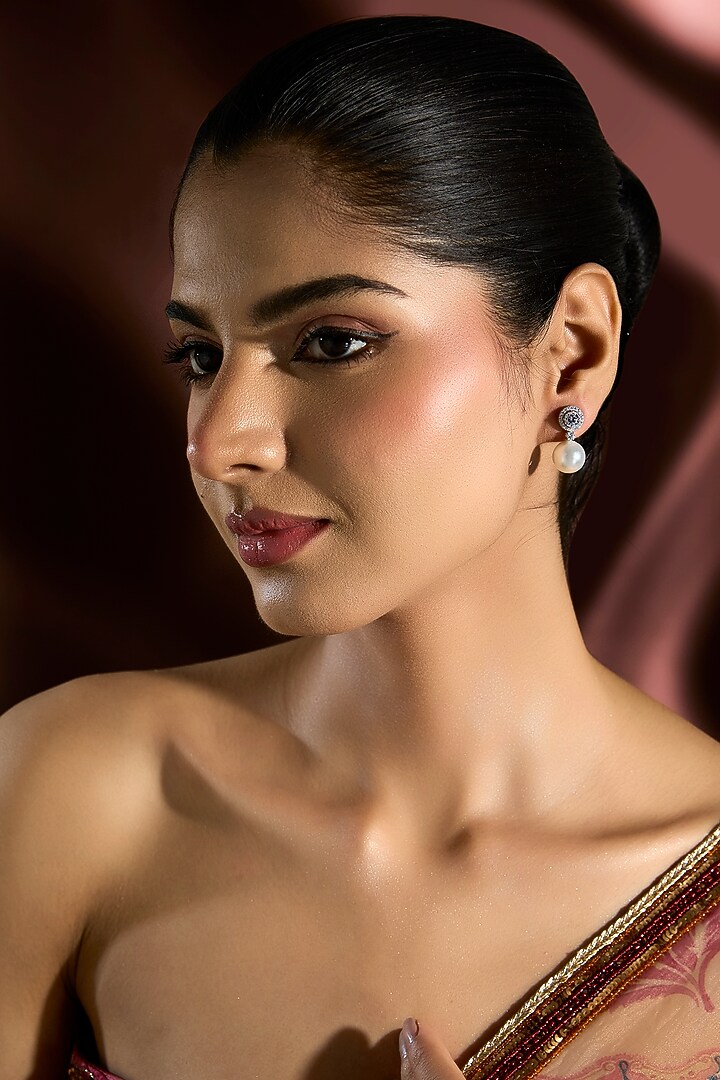 White Gold Finish Swarovski & Pearl Stud Earrings In Sterling Silver by STELLA CREATIONS at Pernia's Pop Up Shop