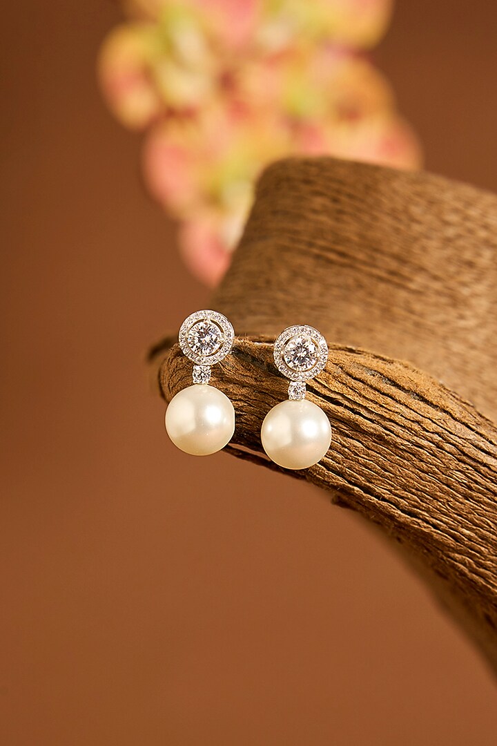 White Gold Finish Swarovski & Pearl Stud Earrings In Sterling Silver by STELLA CREATIONS at Pernia's Pop Up Shop