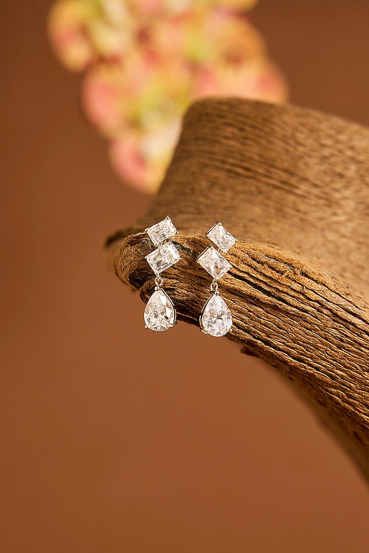White Gold Finish Eurostar Swarovski Dangler Earrings In Sterling Silver by STELLA CREATIONS at Pernia's Pop Up Shop