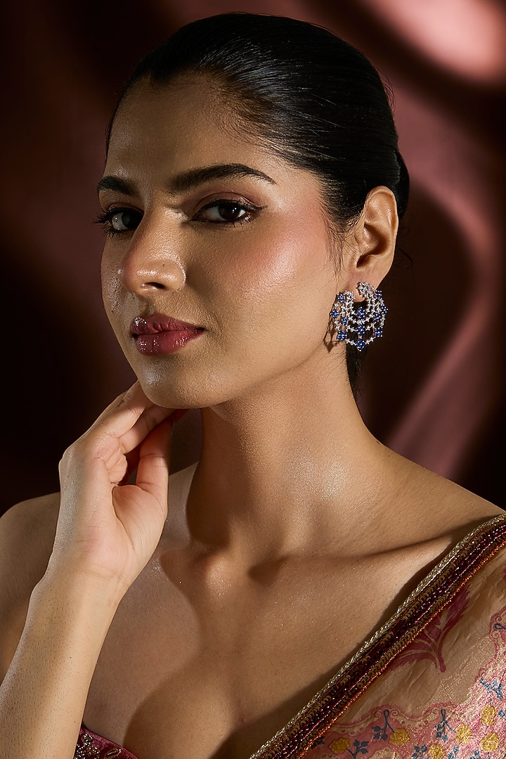 White Gold Finish Swarovski & Sapphire Stud Earrings In Sterling Silver by STELLA CREATIONS at Pernia's Pop Up Shop