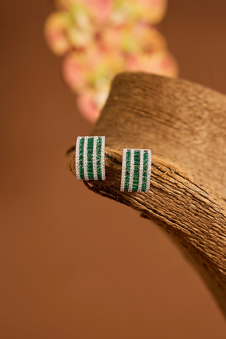 White Gold Finish Swarovski & Emerald Stud Earrings In Sterling Silver by STELLA CREATIONS at Pernia's Pop Up Shop
