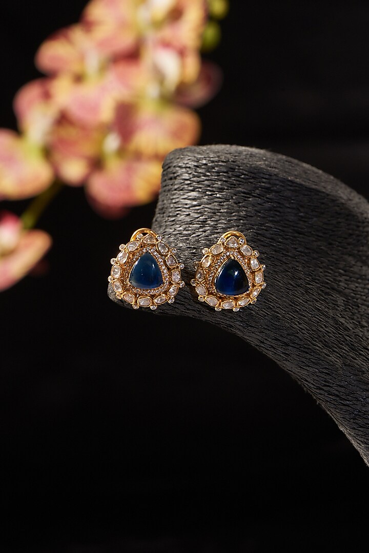 Gold Finish Moissanite Polki & Synthetic Sapphire Stone Stud Earrings In Sterling Silver by STELLA CREATIONS at Pernia's Pop Up Shop