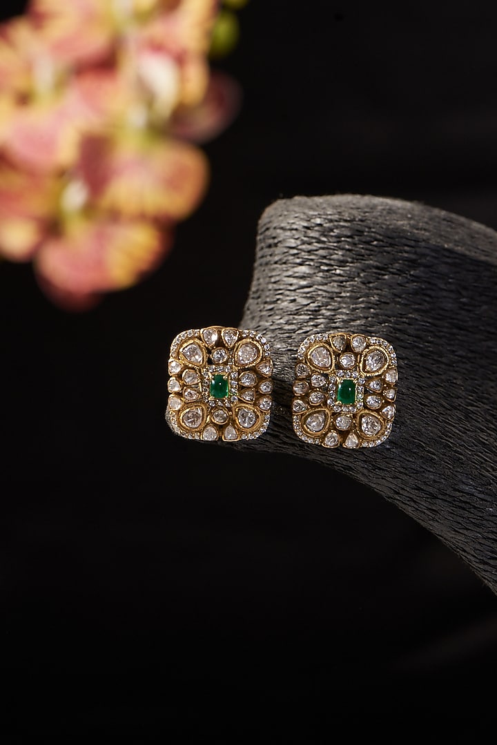 Gold Finish Moissanite Polki & Synthetic Emerald Stone Stud Earrings In Sterling Silver by STELLA CREATIONS at Pernia's Pop Up Shop