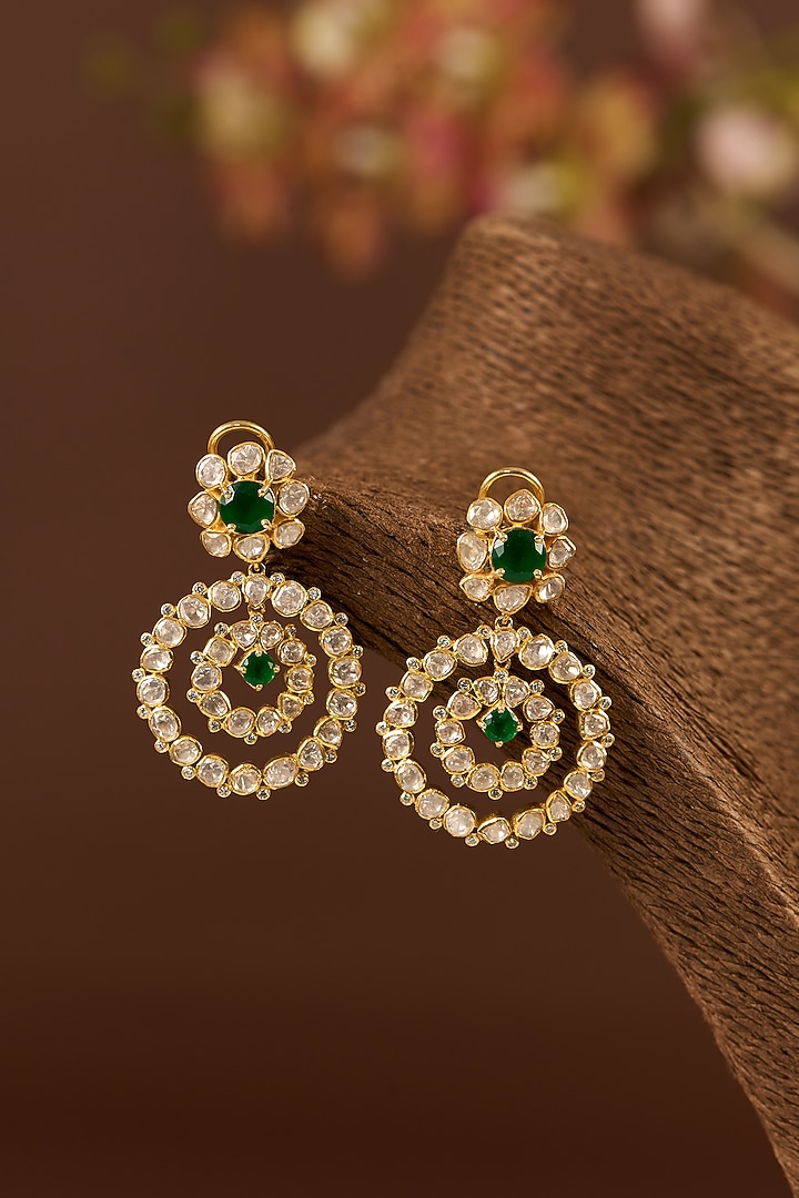 Gold Finish Moissanite Polki & Emerald Dangler Earrings In Sterling Silver by STELLA CREATIONS at Pernia's Pop Up Shop