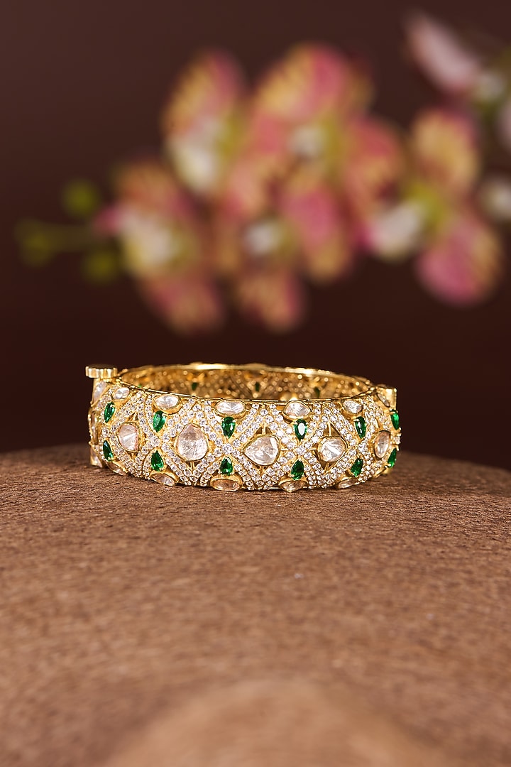 Gold Finish Moissanite Polki & Emerald Bangle In Sterling Silver by STELLA CREATIONS at Pernia's Pop Up Shop