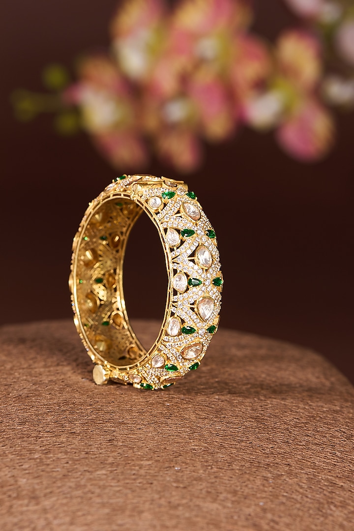 Gold Finish Moissanite Polki & Emerald Bangle In Sterling Silver by STELLA CREATIONS at Pernia's Pop Up Shop