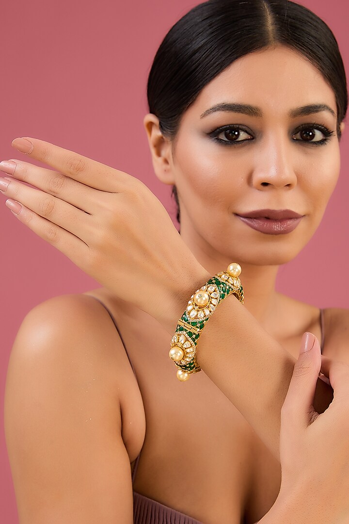 Gold Finish Moissanite Polki & Emerald Bangle In Sterling Silver by STELLA CREATIONS at Pernia's Pop Up Shop