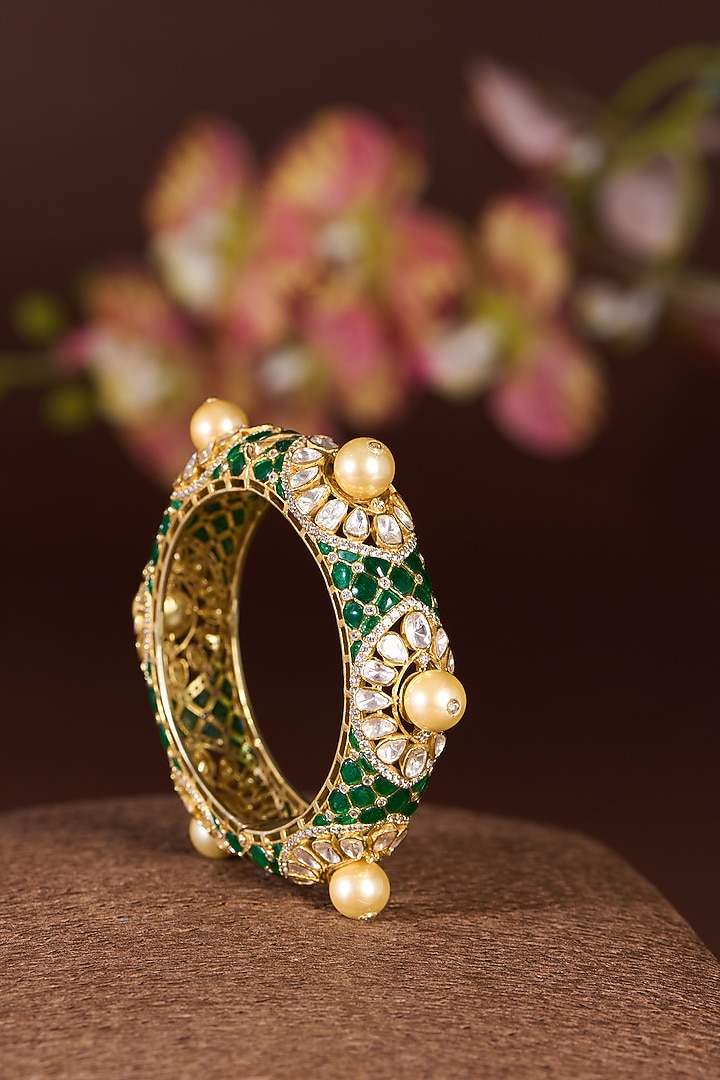 Gold Finish Moissanite Polki & Emerald Bangle In Sterling Silver by STELLA CREATIONS at Pernia's Pop Up Shop