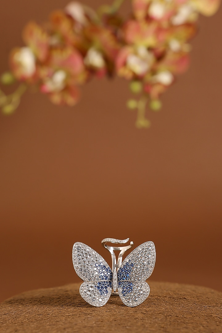 White Gold Finish Swarovski & Sapphire Flapping Ring In Sterling Silver by STELLA CREATIONS at Pernia's Pop Up Shop
