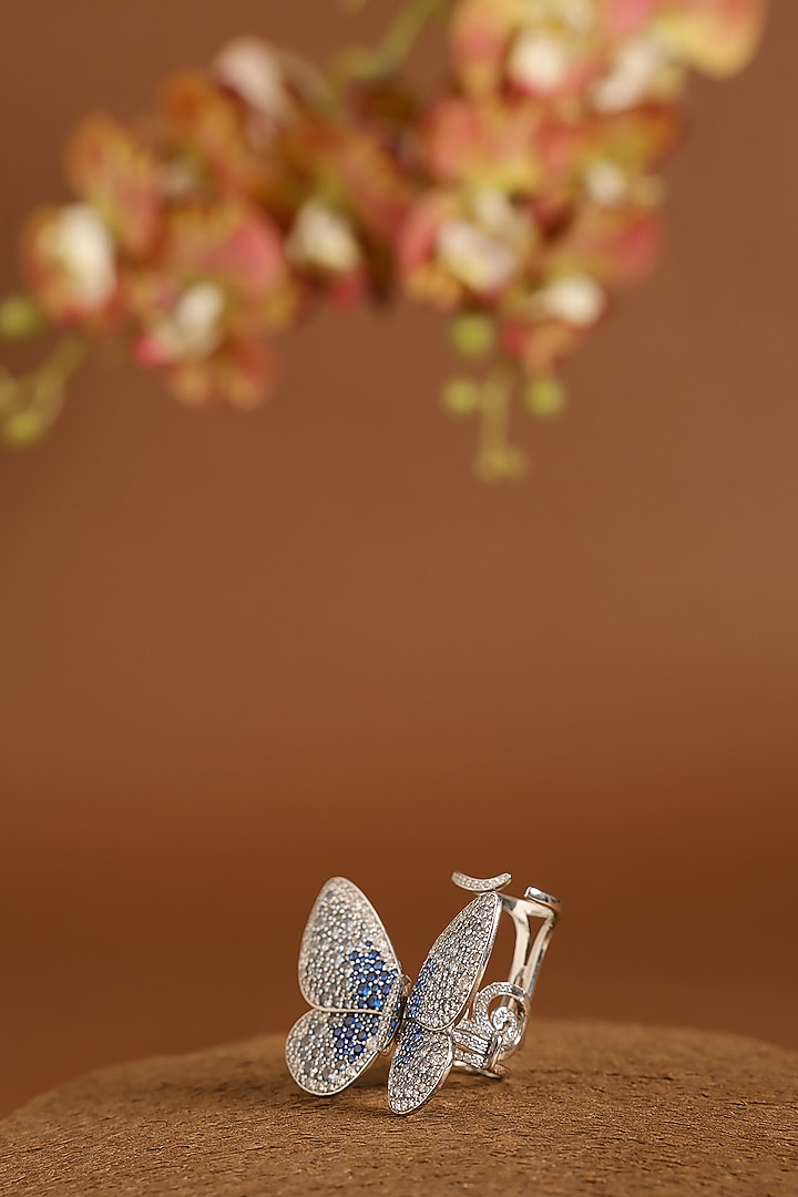 White Gold Finish Swarovski & Sapphire Flapping Ring In Sterling Silver by STELLA CREATIONS at Pernia's Pop Up Shop