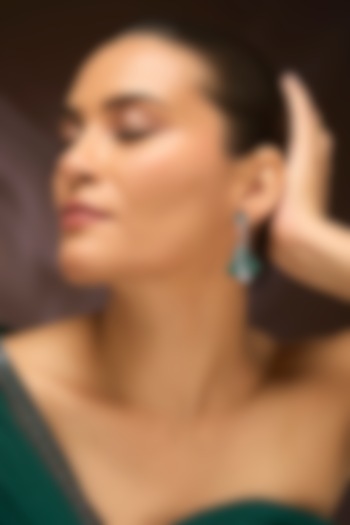 White Gold Finish Swarovski & Emerald Dangler Earrings In Sterling Silver by STELLA CREATIONS at Pernia's Pop Up Shop