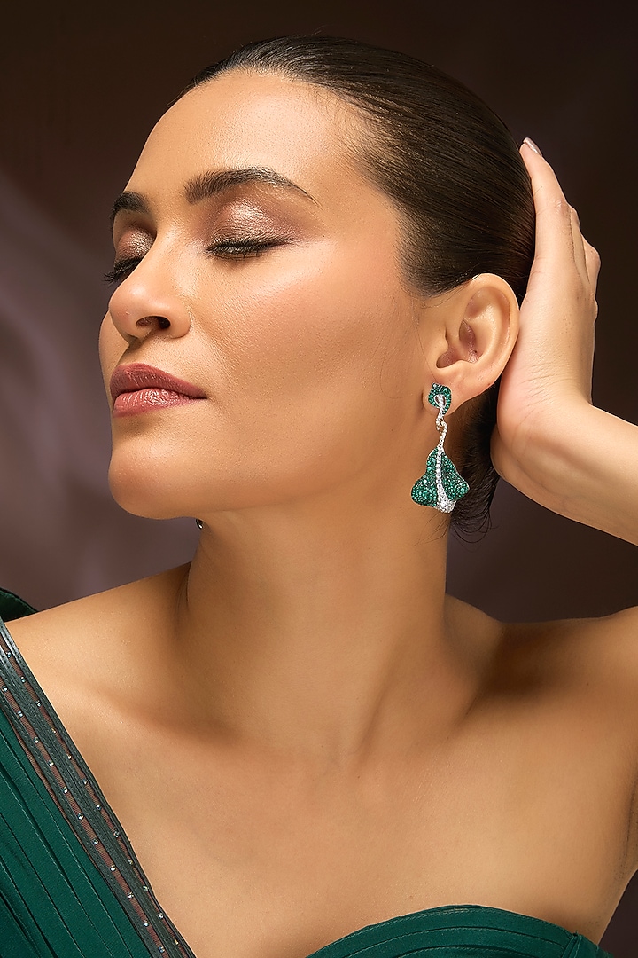 White Gold Finish Swarovski & Emerald Dangler Earrings In Sterling Silver by STELLA CREATIONS at Pernia's Pop Up Shop