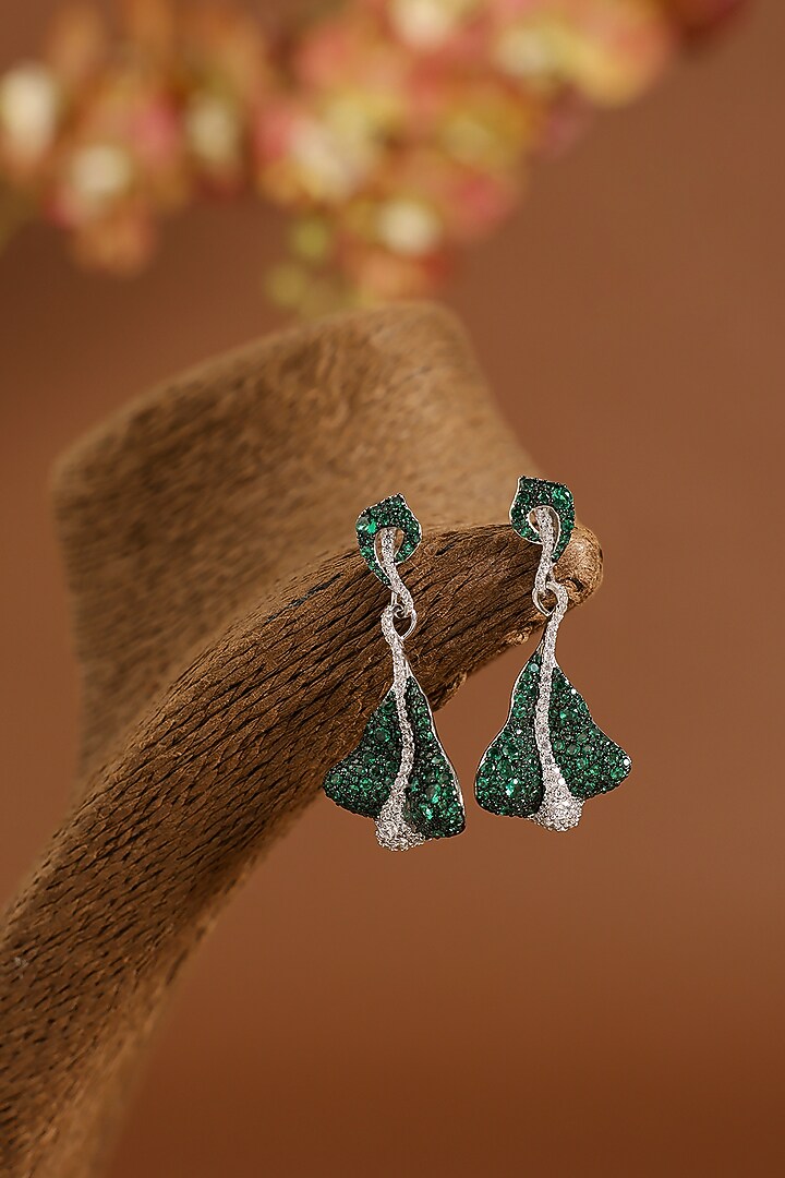 White Gold Finish Swarovski & Emerald Dangler Earrings In Sterling Silver by STELLA CREATIONS at Pernia's Pop Up Shop