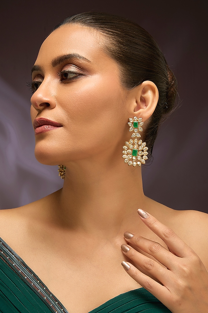 Yellow Gold Finish Moissanite Polki & Emerald Dangler Earrings In Sterling Silver by STELLA CREATIONS at Pernia's Pop Up Shop