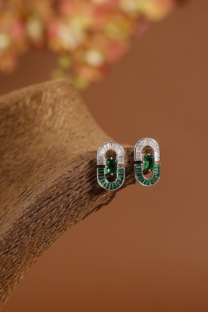 White Gold Finish Swarovski & Emerald Stud Earrings In Sterling Silver by STELLA CREATIONS at Pernia's Pop Up Shop