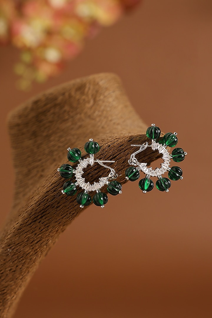 White Gold Finish Swarovski & Emerald Stud Earrings In Sterling Silver by STELLA CREATIONS at Pernia's Pop Up Shop