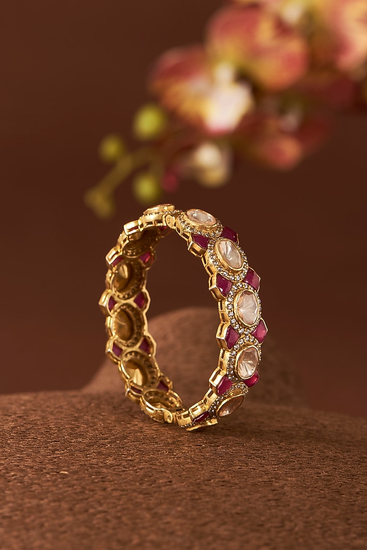 Yellow Gold Finish Moissanite Polki & Ruby Bangle In Sterling Silver by STELLA CREATIONS at Pernia's Pop Up Shop