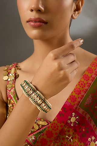 Yellow Gold Finish Moissanite Polki & Emerald Stone Bracelet In Sterling Silver by STELLA CREATIONS