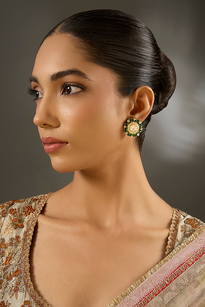 Yellow Gold Finish Moissanite Polki & Emerald Stone Stud Earrings In Sterling Silver by STELLA CREATIONS at Pernia's Pop Up Shop