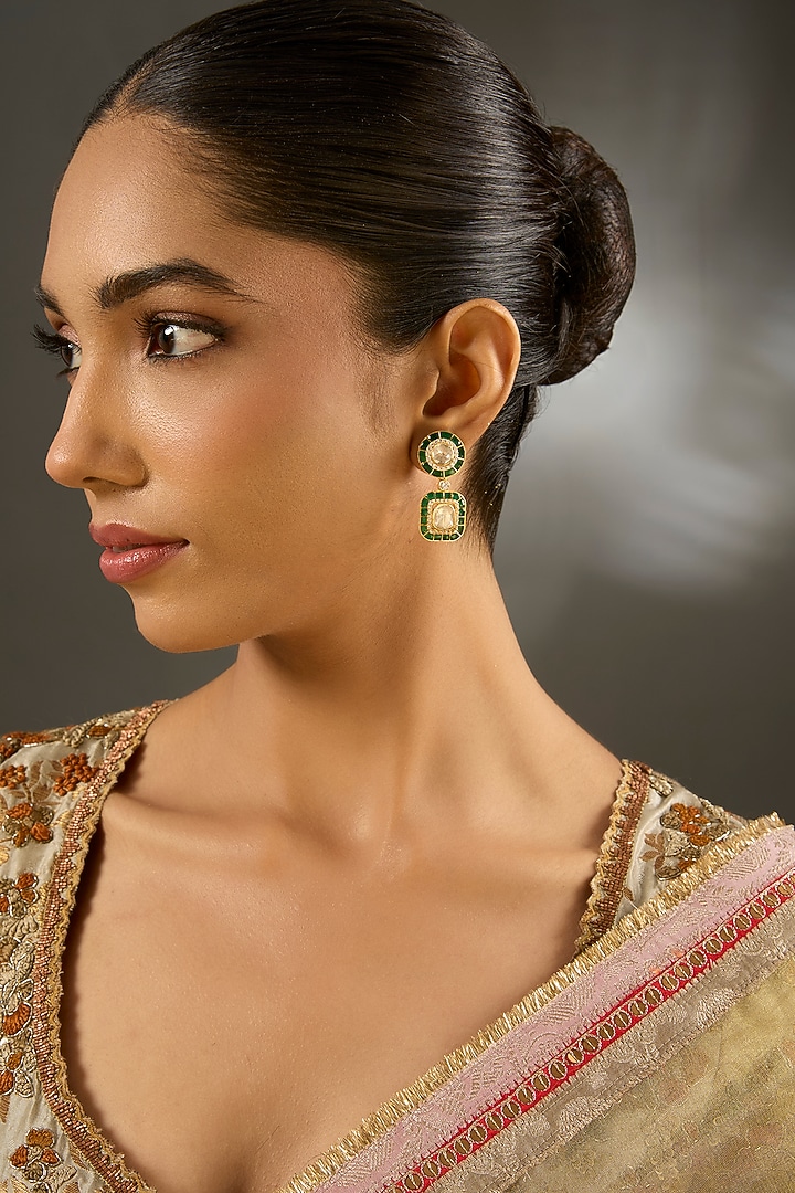 Yellow Gold Finish Moissanite Polki & Emerald Stone Dangler Earrings In Sterling Silver by STELLA CREATIONS at Pernia's Pop Up Shop