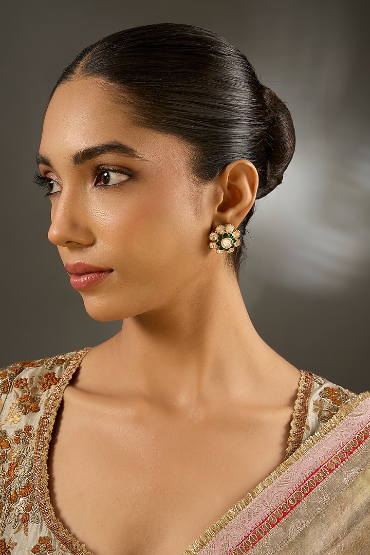 Yellow Gold Finish Moissanite Polki & Emerald Stone Stud Earrings In Sterling Silver by STELLA CREATIONS at Pernia's Pop Up Shop