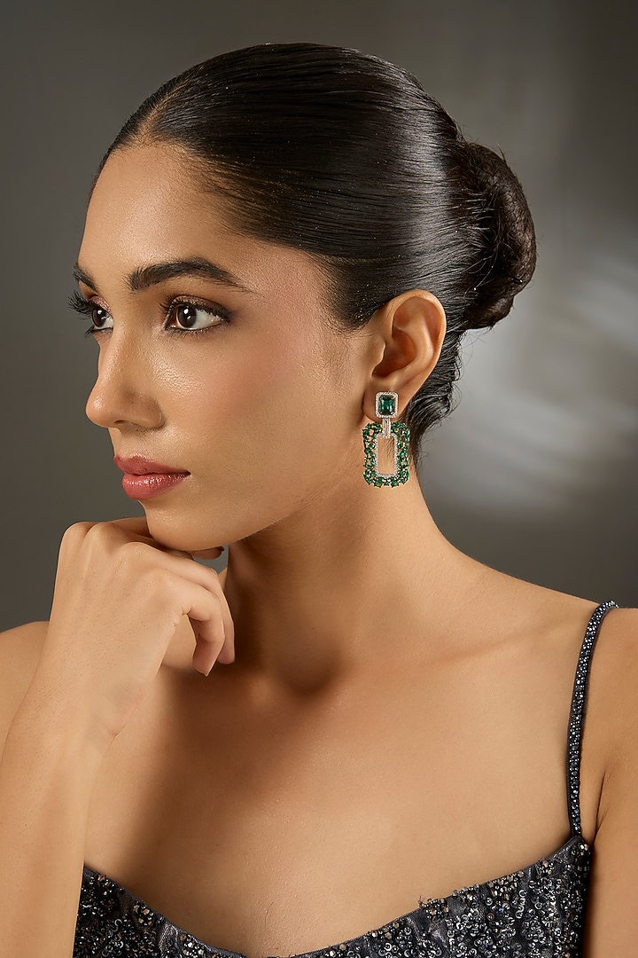 White Gold Finish Zircon & Emerald Stone Dangler Earrings In Sterling Silver by STELLA CREATIONS at Pernia's Pop Up Shop