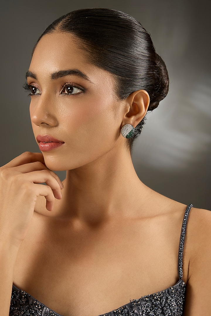 White Finish Zircon & Emerald Stone Stud Earrings In Sterling Silver by STELLA CREATIONS at Pernia's Pop Up Shop