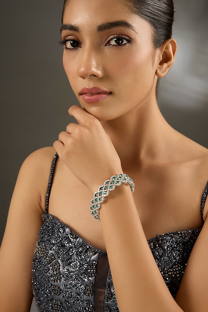 White Gold Finish Zircon & Emerald Stone Openable Bracelet In Sterling Silver by STELLA CREATIONS at Pernia's Pop Up Shop
