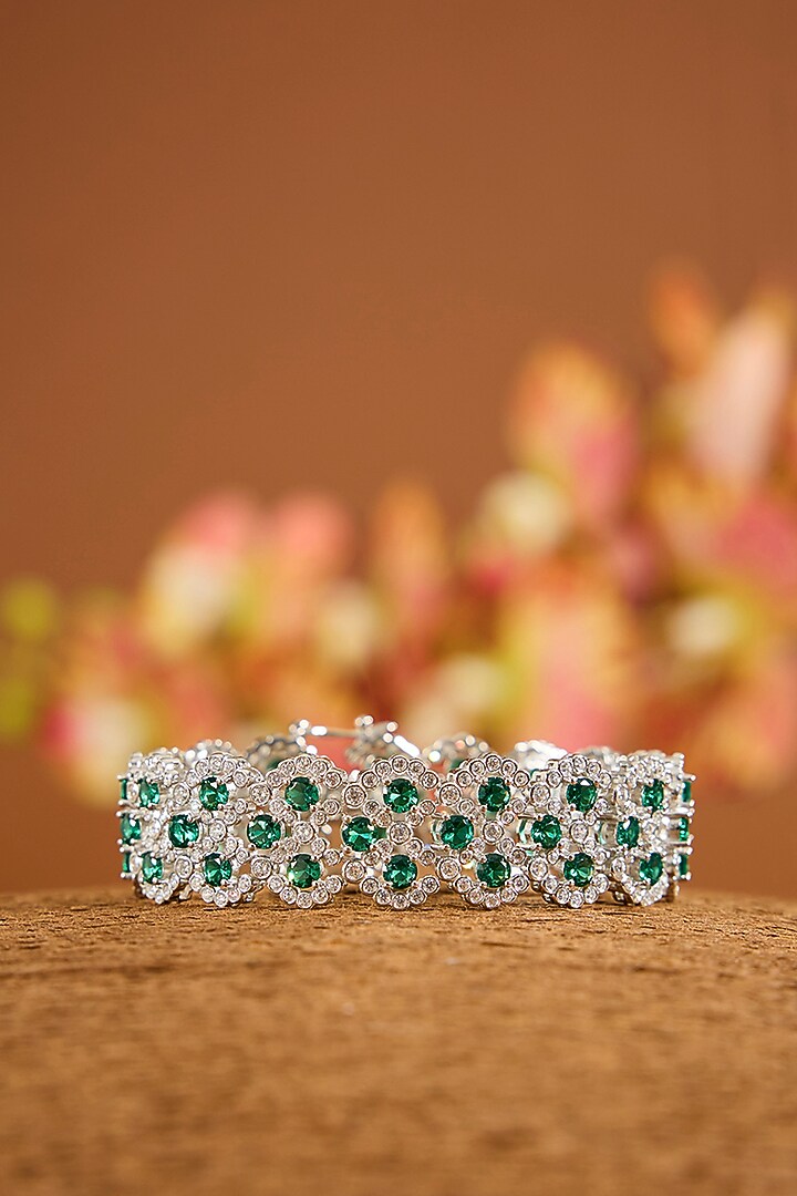 White Gold Finish Zircon & Emerald Stone Openable Bracelet In Sterling Silver by STELLA CREATIONS at Pernia's Pop Up Shop