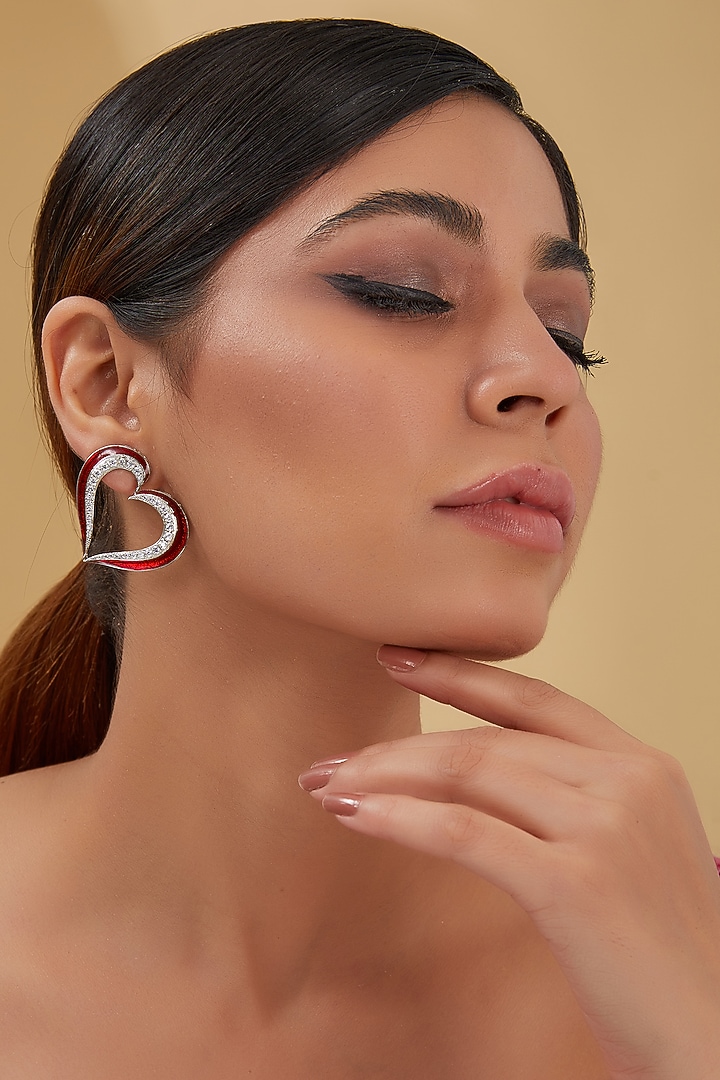 White Finish Zircon & Red Enameled Stud Earrings In Sterling Silver by STELLA CREATIONS at Pernia's Pop Up Shop