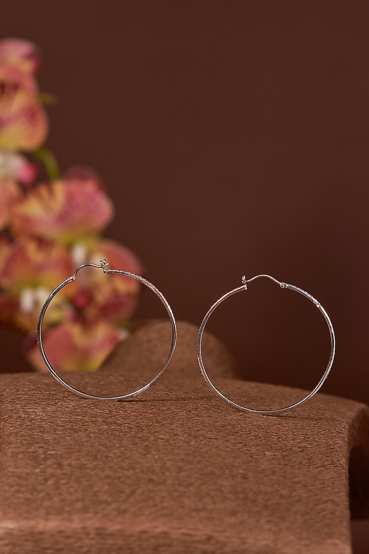 White Finish Zircon Hoop Earrings In Sterling Silver by STELLA CREATIONS at Pernia's Pop Up Shop