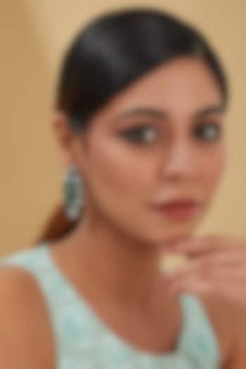 White Finish Zircon & Emerald Dangler Earrings In Sterling Silver by STELLA CREATIONS at Pernia's Pop Up Shop