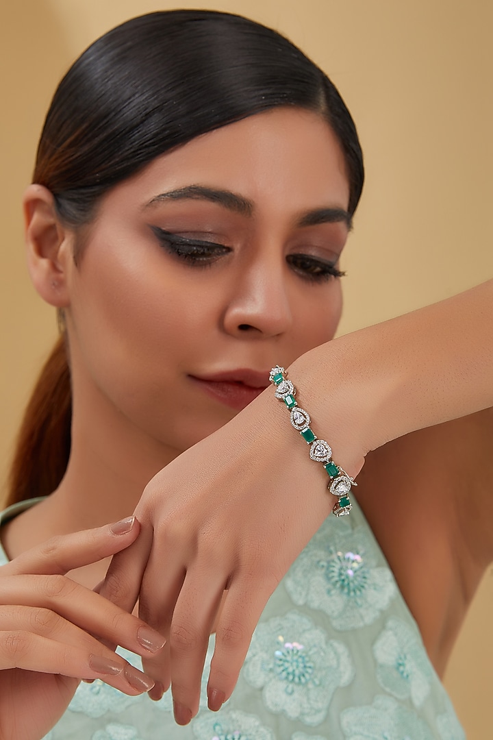 White Finish Zircon & Emerald Bracelet In Sterling Silver by STELLA CREATIONS at Pernia's Pop Up Shop