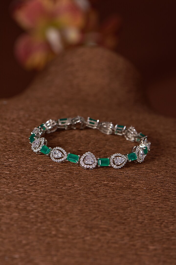White Finish Zircon & Emerald Bracelet In Sterling Silver by STELLA CREATIONS at Pernia's Pop Up Shop