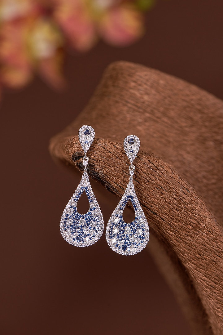 White Finish Zircon & Blue Sapphire Dangler Earrings In Sterling Silver by STELLA CREATIONS at Pernia's Pop Up Shop